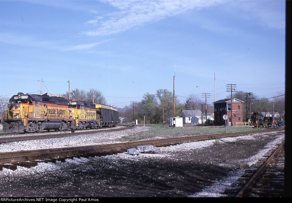 CSX 6209 with a Unit Grain train made up of 100 Ton 3 bay hoppers with "Hopper Toppers'